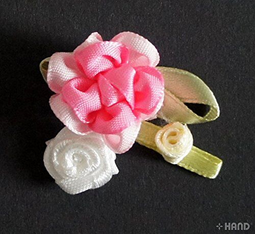 Pack of 30 decorative flowers for various craft projects.