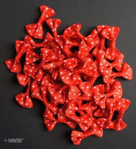 Display of red ribbon bows in various arrangements