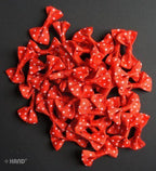 Display of red ribbon bows in various arrangements