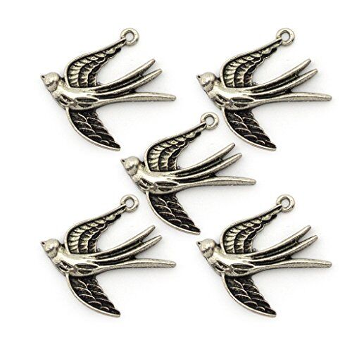 Close-up of a silver colour swallow pendant on a white background.