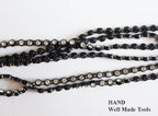 Spool of black diamante trim ready for use in crafts