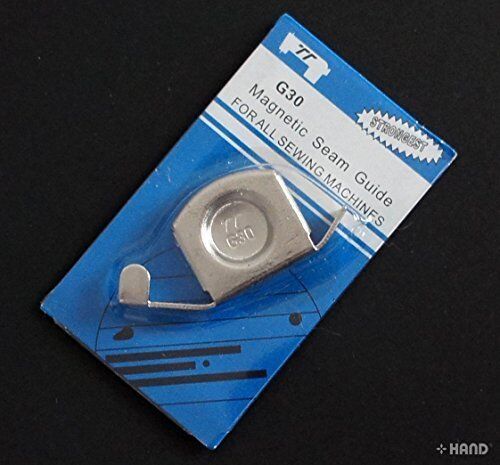 Close-up of the magnetic seam guide on a sewing machine