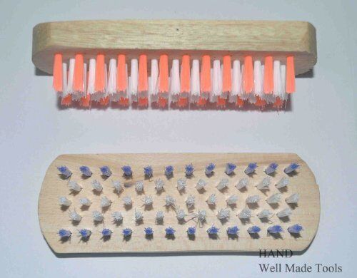 Professional garment brush with a wooden handle for clothes care