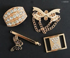 Variety of gold tone DIY accessories with Diamote gems on a craft table.