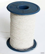 Large roll of off white shirring elastic on a spool