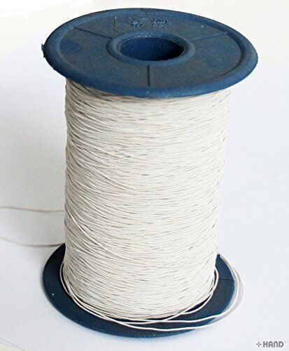 Large roll of off white shirring elastic on a spool