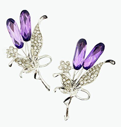 Elegant brooch with clear crystals and purple rhinestones in flower design.
