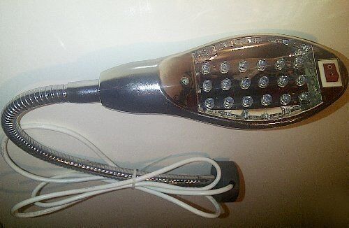 Magnetic base of the sewing machine lamp on a surface