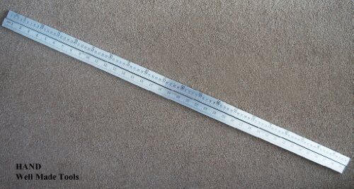 Double side ruler showing metric measurements in inches and centimetres.