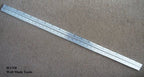 Double side ruler showing metric measurements in inches and centimetres.
