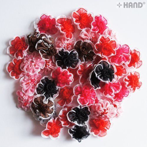 Assorted colours of F14 decorative flower trims displayed