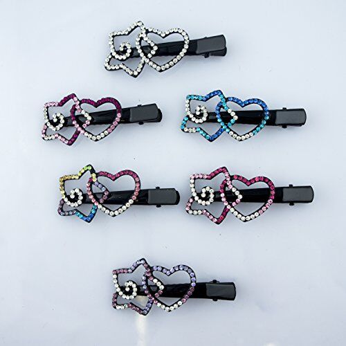 Close-up of black hair clips featuring vibrant crystal designs.