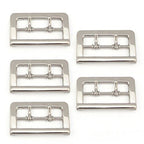 Five silver metal double lock belt buckles on a white background.