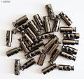 Close-up of dark copper tone toggle spring stop cord locks.
