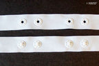 Close-up of 10 metres push button tape in white, 18mm wide.