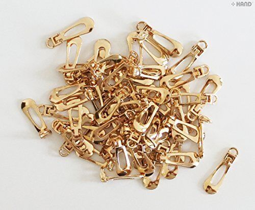 Small gold zip pulls displayed on a white background