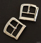 Close-up of a 2.2cm silver tone buckle with slider bar.