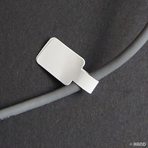 Close-up of white tag labels for jewellery pricing on a sheet