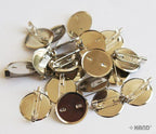 Close-up of a 25mm silver plate badge pin with backing