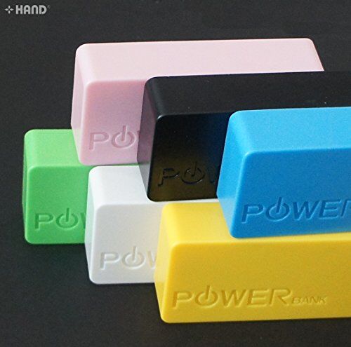 Power bank charging a smartphone on a table