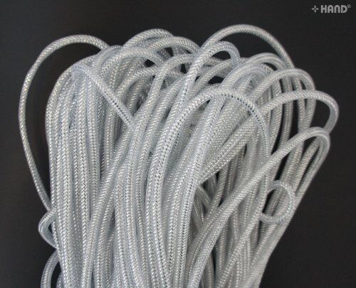 Craft project using silver tubular crin elastic for embellishment.