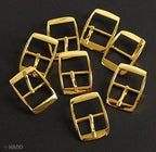 Close-up of the 2.2cm polished gold tone square buckle