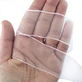 White and pink decorative organza trim on a roll