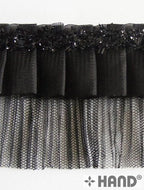 White variant of ruffle net trim with decorative border