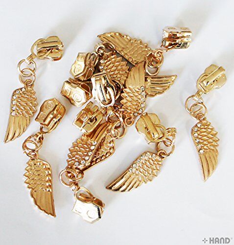 Close-up of a gold tone decorative wing zip pull
