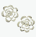 Two elegant clear crystal silver tone rose brooches displayed together.