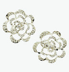 Two elegant clear crystal silver tone rose brooches displayed together.