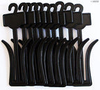Close-up of a plastic black shoe hanger holding a slipper