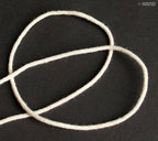 20 metres of cream thin string rope cord in a neat coil