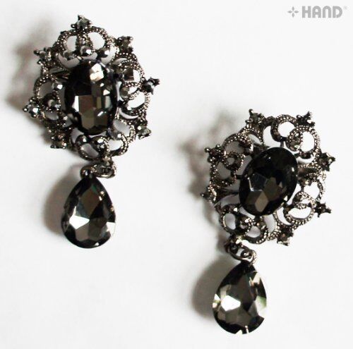 Close-up of a vintage brooch showcasing black crystals