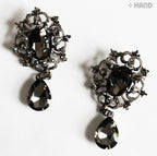 Close-up of a vintage brooch showcasing black crystals