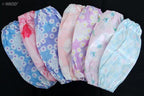 Satin sleeve arm protectors worn while crafting to protect clothing