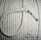 Close-up of white fabric finishing lead curtain weigh tape