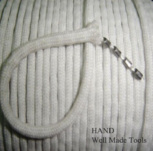 Close-up of white fabric finishing lead curtain weigh tape