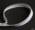 Close-up of Silver Edge Sew in Pipe Trim in White and Silver