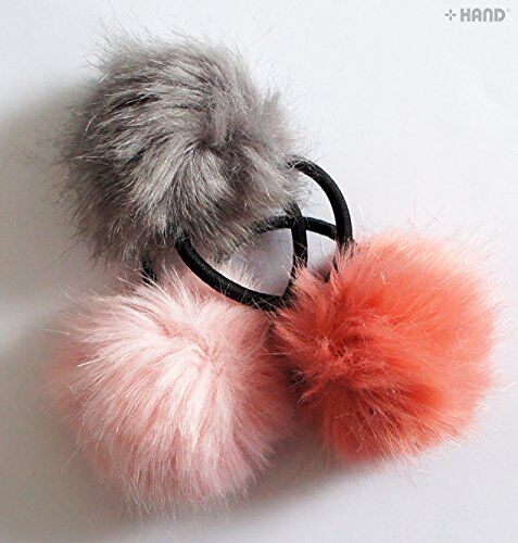 Three assorted colours of pom pom hair bands displayed together.