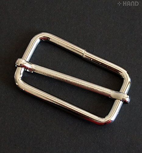 Close-up of a 4cm silver tone metal slider showing detail.