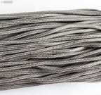 Dark green nylon string displayed with measuring tape