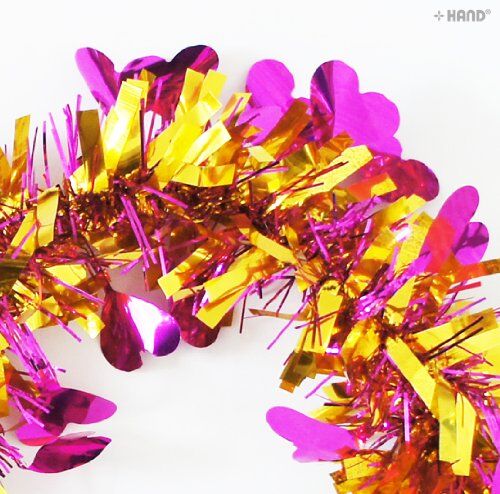 Gold heart tinsel garland displayed on a table