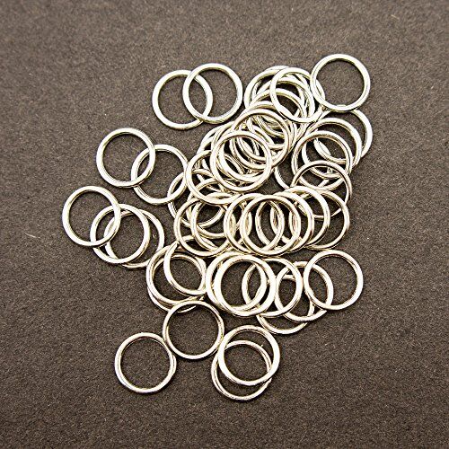 Pack of approximately 50 metal O shape lingerie rings displayed