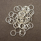 Pack of approximately 50 metal O shape lingerie rings displayed
