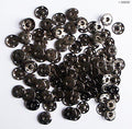 Close-up of dark copper snap studs in 21mm size