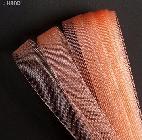 Roll of salmon pink nylon crin trim showing texture and colour
