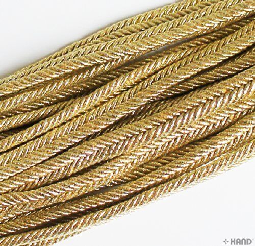Close-up of silver metallic plait cord texture.