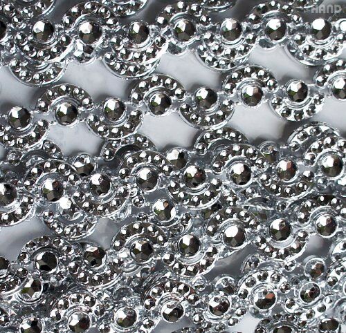 Roll of Pretty Silver Moon Shape Trims showing detailed moon shapes