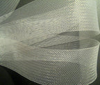 Craft project featuring white nylon crin trim as a decorative element.